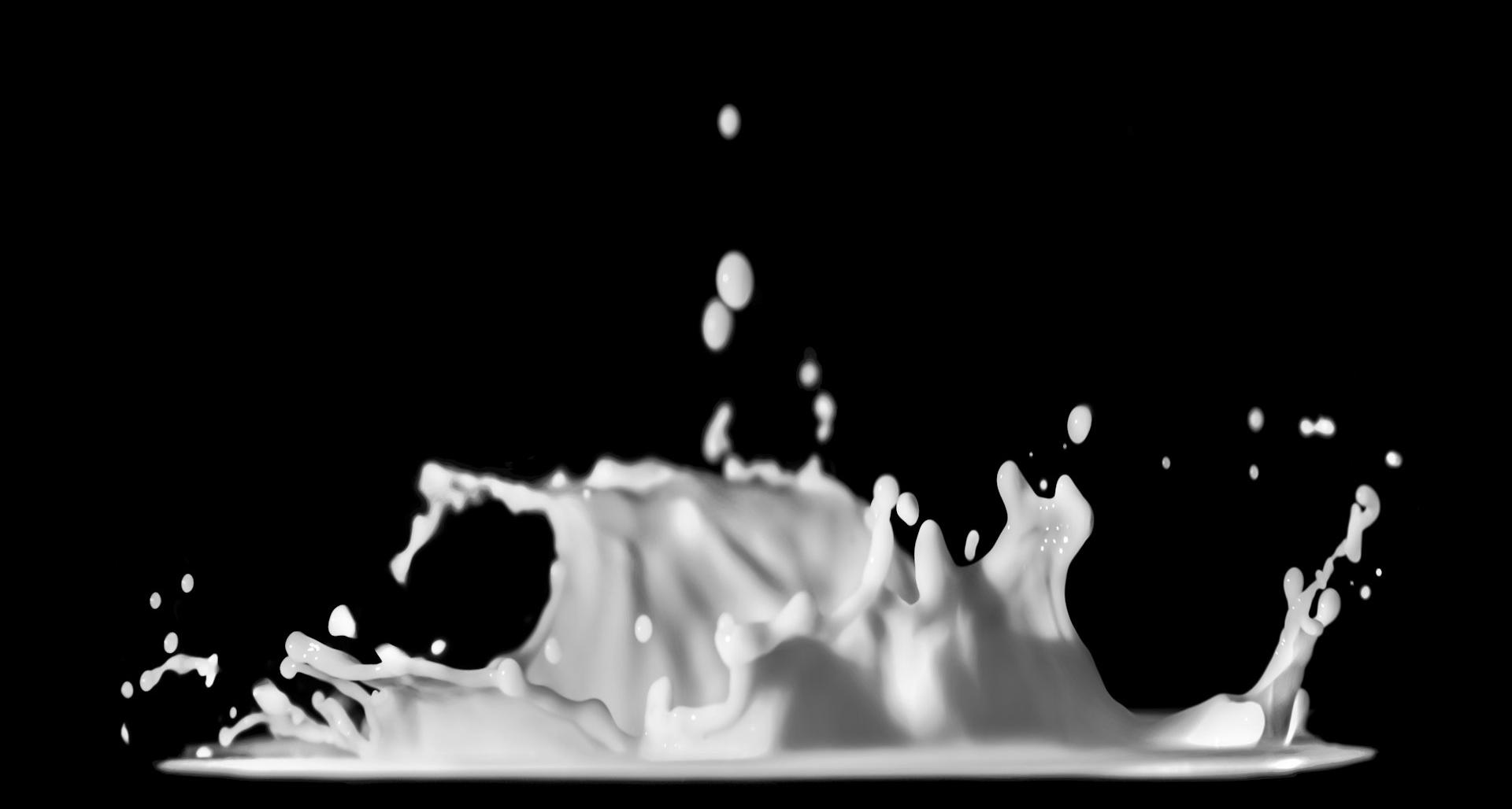 a black and white photo of a liquid splash